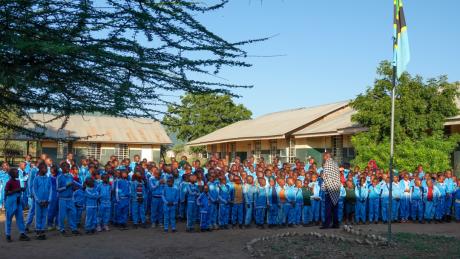 Pupils from Naserian Primary School in Malambo, Tanzania, are addressed by their teacher during a parade
