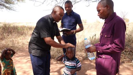 Eric Dadi being baptized