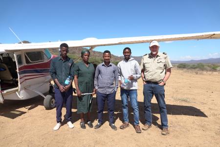From left: Tumaini, Monica, Yohani, Pasqalu and MAF pilot Mark Liprini at Endanyawish airstrip after the mobile clinic