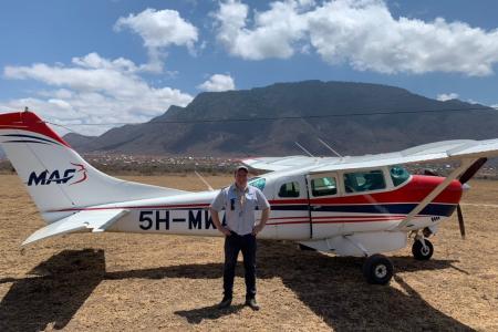 MAF Pilot Jarkko Korhonen posing by the Cessna 206.