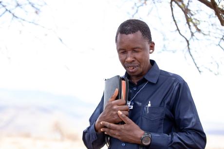 Pastor praying - Malambo safari
