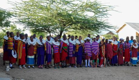 Children dressed in their traditional attire, ready to entertain guests.