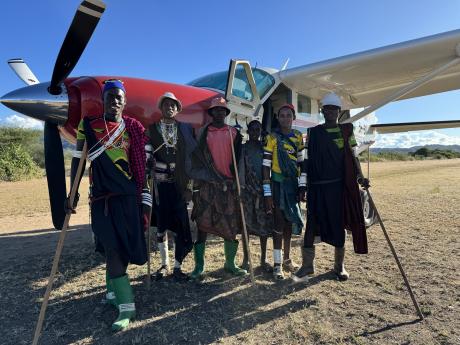 Villagers from Mahaka pose in front of the Caravan