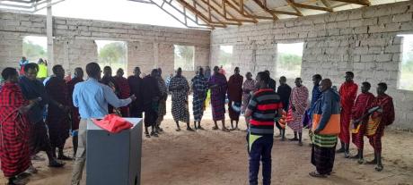 Maasai men being preached to.