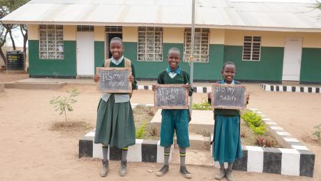 Elinami and colleagues holding placards