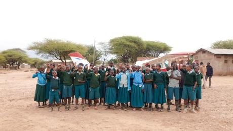 Students standing in front of a MAF plane